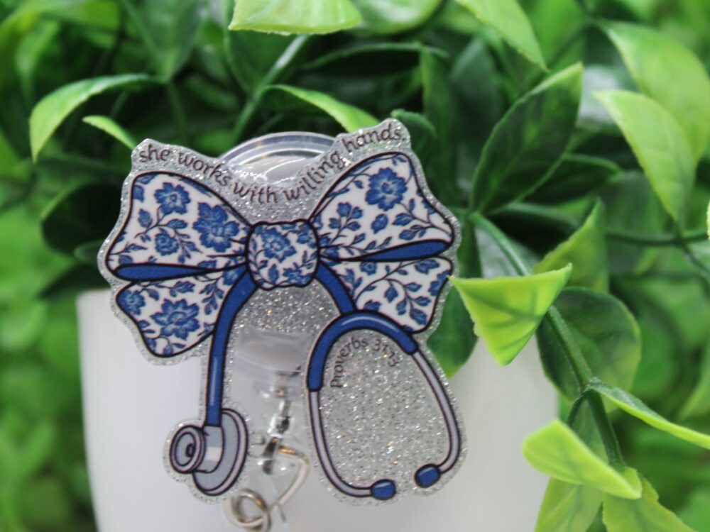 She Works With Willing Hands Blue Floral Stethoscope Bow Badge Reel