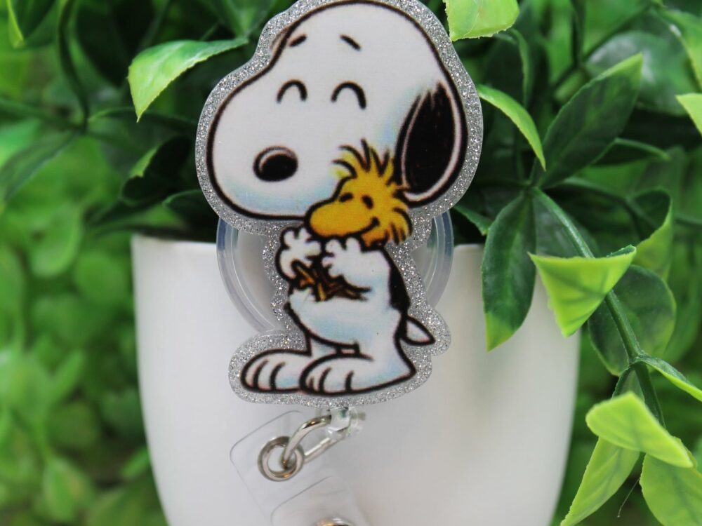 White Dog and Bird Badge Reel